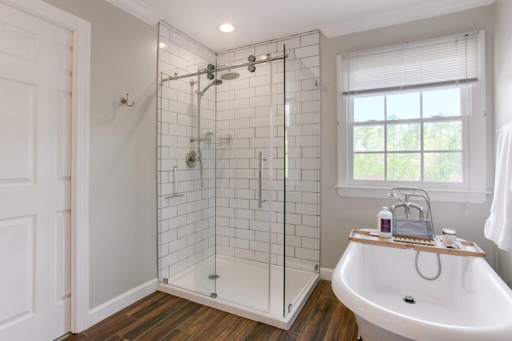 Professional fiberglass shower refinishing restoring stained shower walls in Baltimore Maryland bathroom